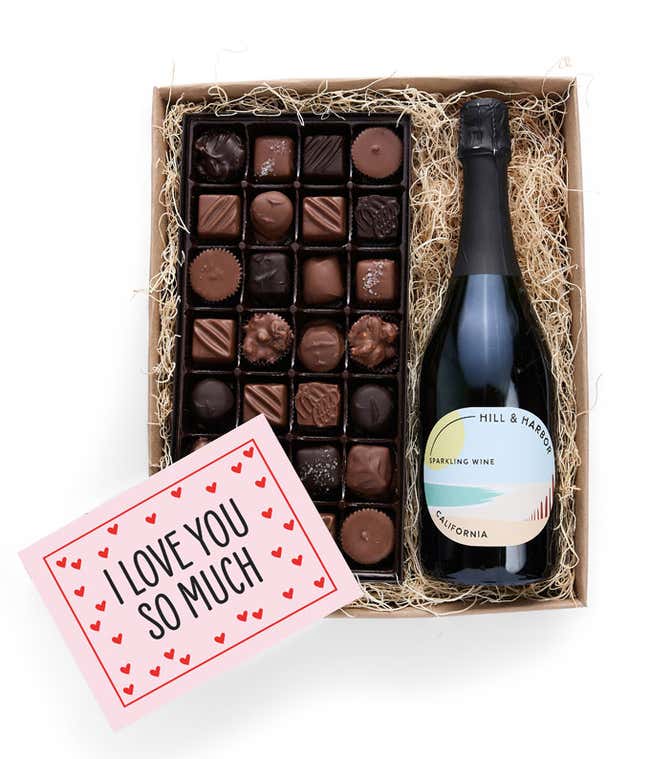 A gift box containing a bottle of California Sparkling wine by Hill &amp; Harbor, a 1 lb box of 28 assorted gourmet chocolates in a grid, and a Season's Greetings message card.   A refined combination perfect for holiday gatherings.